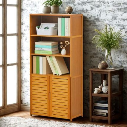 “Wooden bookshelf with cabinet doors, three open shelves displaying plants, books, and decor, placed in a bright room with wooden flooring and indoor plants.”