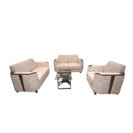 Modern minimalist living room with a stylish beige 3-piece sofa set featuring brown accents, placed on a wooden floor with a geometric-patterned accent wall and a mounted flat-screen TV.