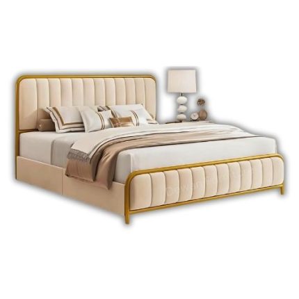 Elegant modern upholstered bed with beige padding and gold metal frame in a stylish bedroom with sunburst mirror, bedside lamp, and floor-to-ceiling curtains.