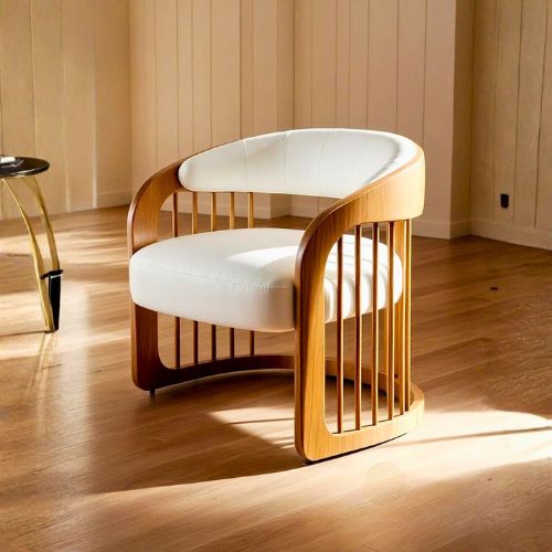 Modern wooden lounge chair with curved frame and white upholstered seat, placed in a bright living room with wooden flooring and soft natural light.